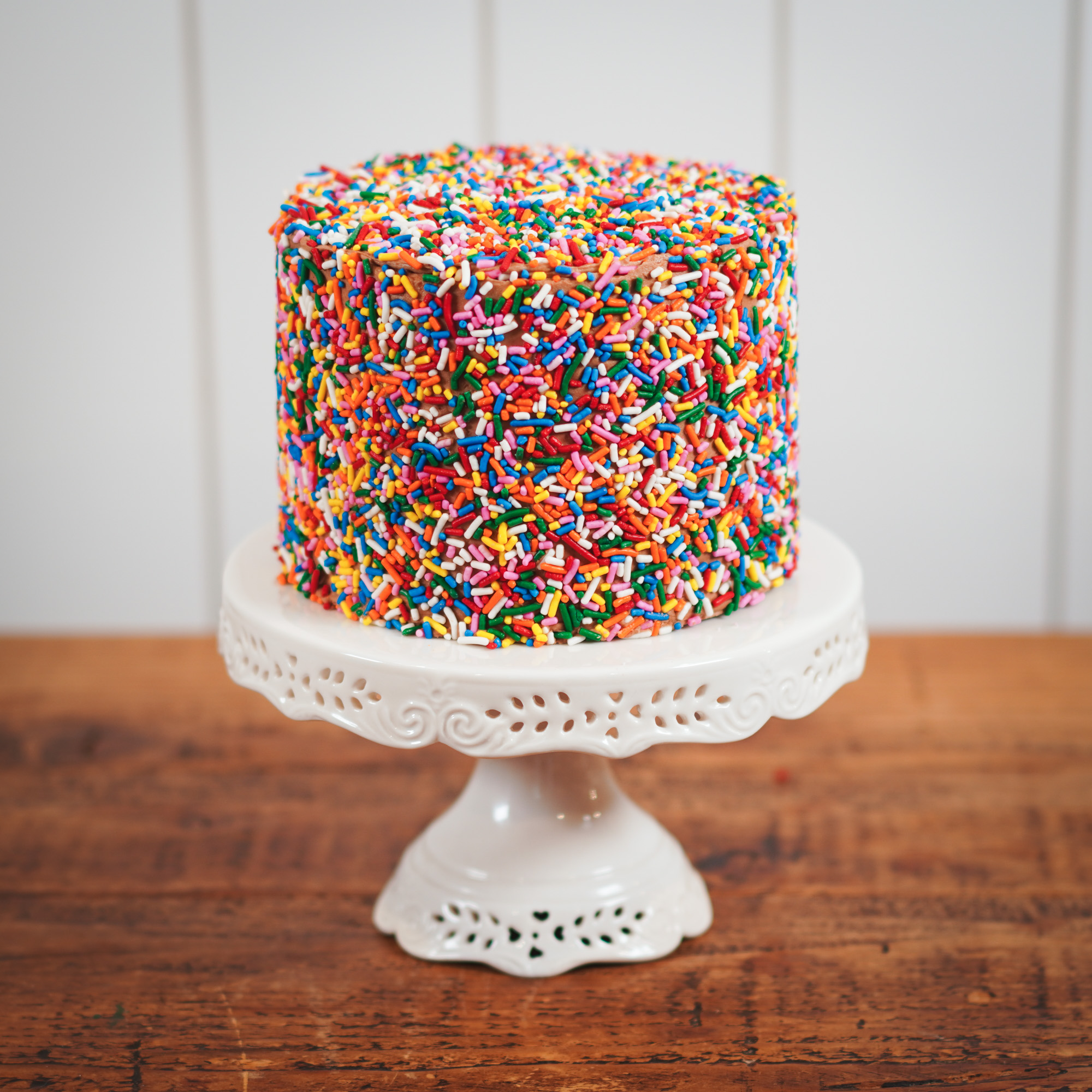 6-inch cake covered in rainbow sprinkles